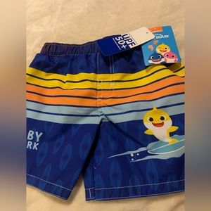 Size 18 months. Baby shark swim trunks. Mesh comfort liner, UPF 50 +